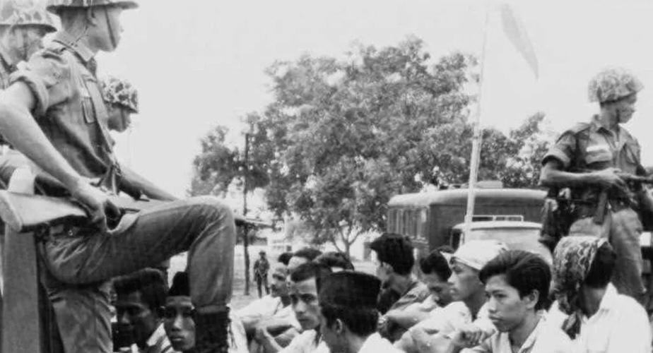 Members of the PKI's youth branch are transported under guard / AP